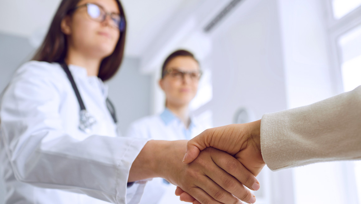 Clinicians shaking hands